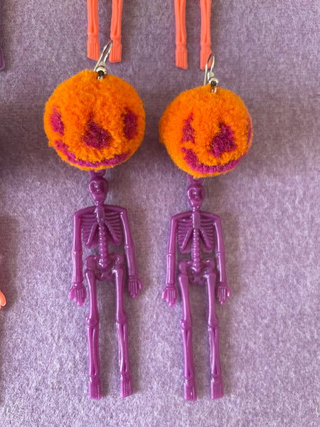 Pumpkin skeleton pompom earrings orange and purple