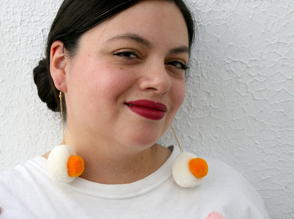 egg pom pom earrings