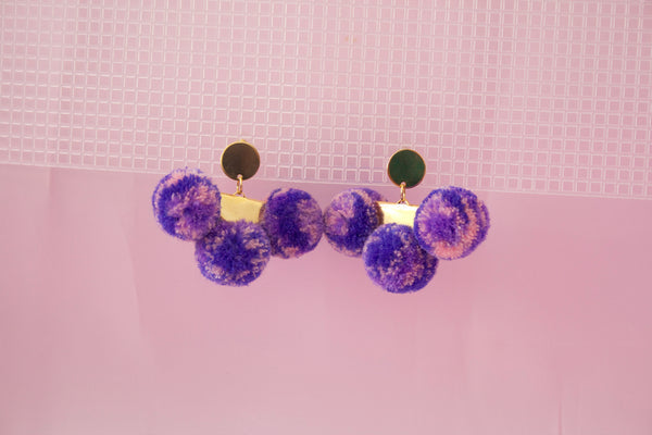 triple pompom earrings