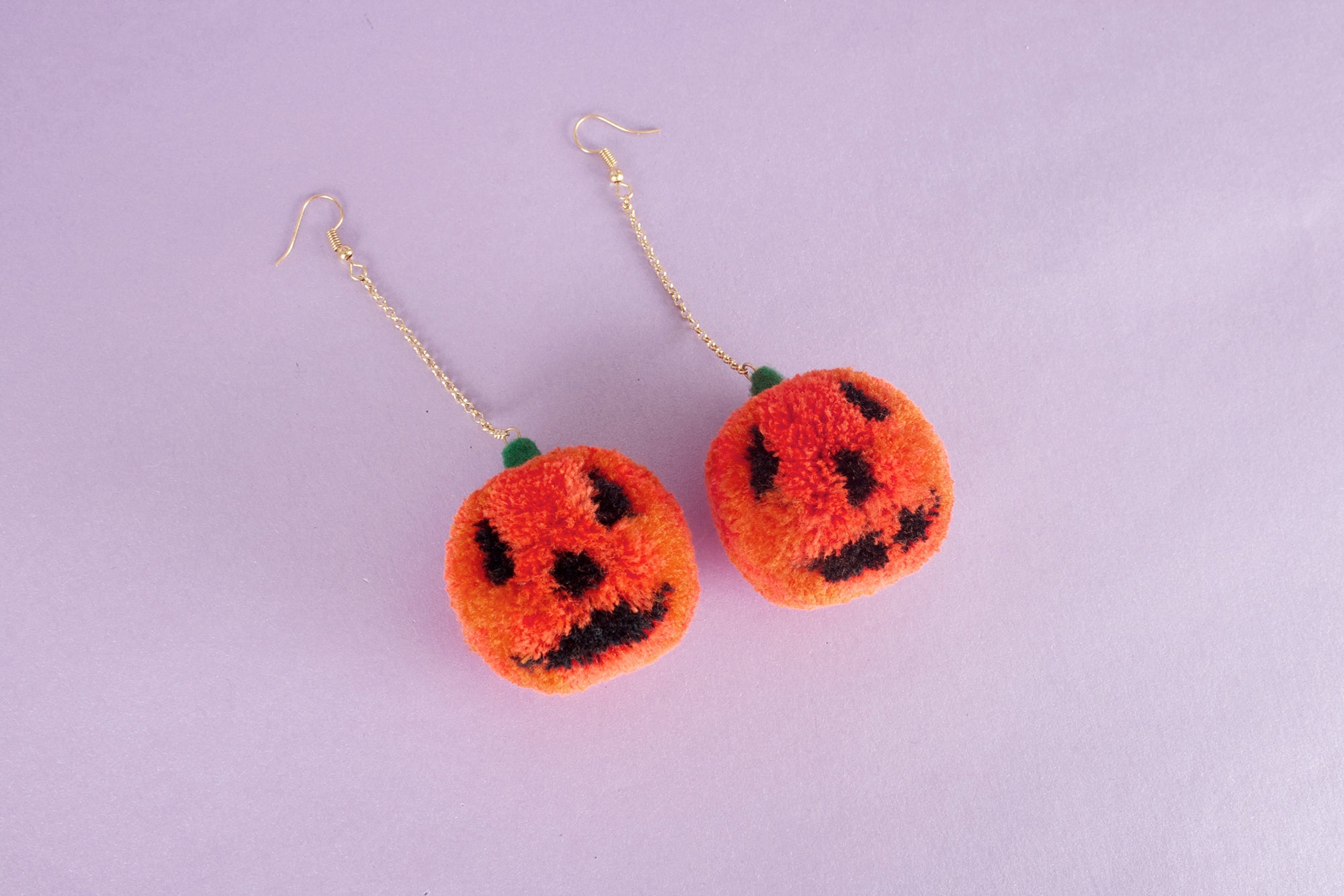 jack o lantern pumpkin pom pom earrings