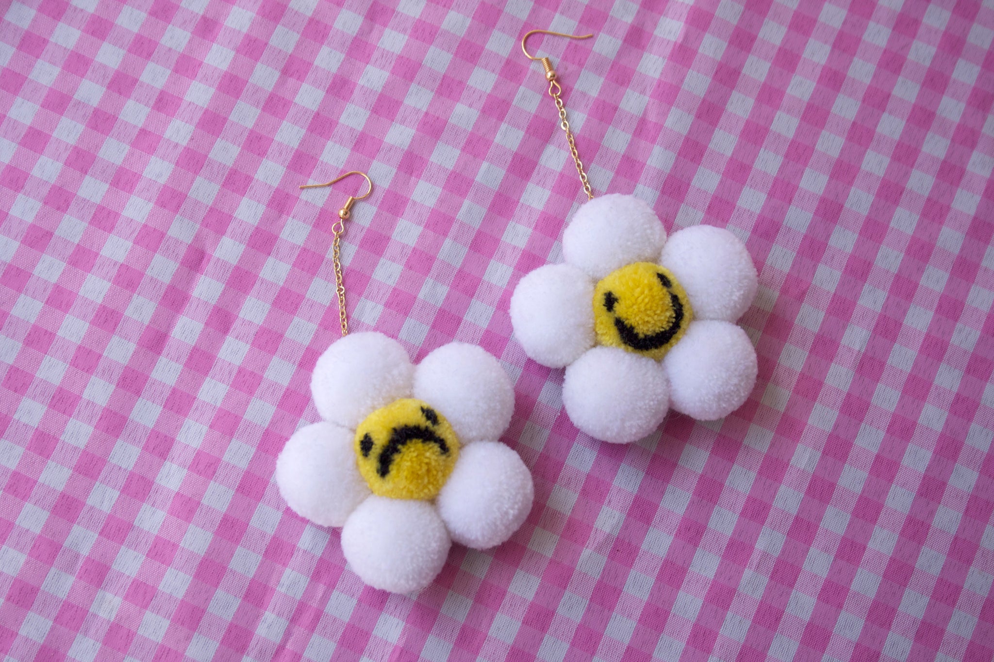 Happy sad daisy pompom earrings